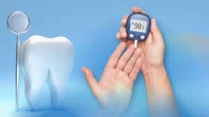 A person having their blood sugar checked, symbolizing diabetes care, alongside a model tooth representing dental health and dental implants.